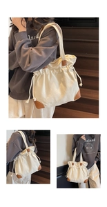 Détail du sac cabas en toile blanc cassé avec coins en cuir marron et cordon serrage
