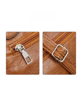 Nahaufnahme der braunen Lederhandtasche mit Litschi-Textur, Silberreißverschluss und Schnalle