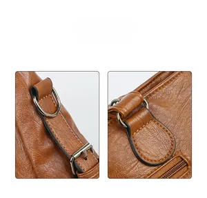 Détails macro du cuir grainé avec anneaux en D argentés et coutures de précision