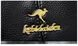 Close-up of golden kangaroo logo and high-quality hardware on black lychee leather bag