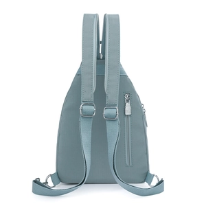Light blue nylon backpack back view with adjustable straps and anti-theft zipper pocket