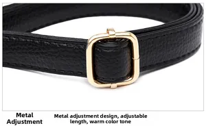 Detail of adjustable black pebble leather strap with golden square metal buckle hardware