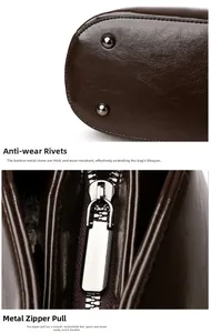 Detail of dark brown leather handbag featuring bottom metal rivets and a durable zipper puller