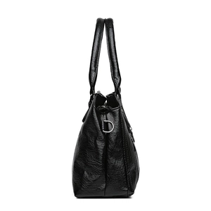 Classic black leather tote bag with glossy texture and large capacity for women