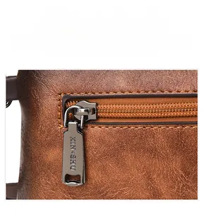 Detail of premium brown leather texture and shiny metallic zipper with vintage buckle