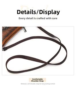 Detail of wide soft shoulder strap with silver metal zipper on vintage envelope bag