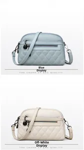 Detail of cross-body bags with quilted leather texture and dual zipper compartments
