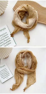 Macro detail of mustard yellow pleated cotton scarf with refined hemmed edges