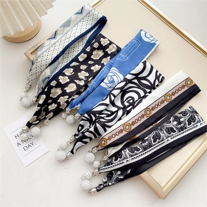 Elegant magnetic silk scarves with pearl pendants in a variety of stylish patterns