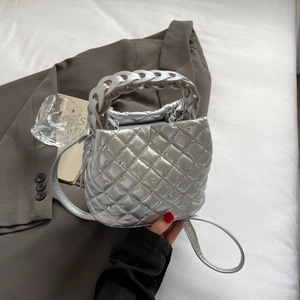 Silver quilted rhinestone handbag with a woven handle and crossbody strap for women