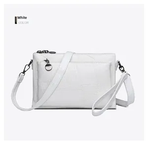Close-up of white PU envelope bag featuring premium crocodile pattern embossed texture