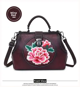 Front view of a wine red vintage doctor bag featuring exquisite peony flower embroidery
