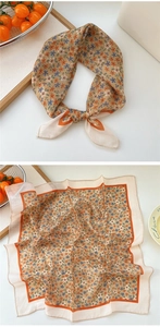 Detail of floral cotton linen neckerchief showing knotted styling and full pattern view