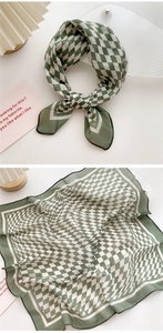 Close-up of green and white checkered cotton linen scarf with fine stitched edges