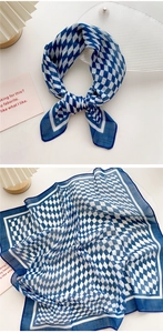 Detail of blue and white checkered cotton linen scarf showing knot style and texture