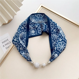 Detail of navy blue floral silk scarf necklace with silver magnetic clasp and crystal charms