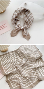 Detail of brown and beige checkered cotton-linen scarf with elegant knotting style