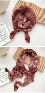 Detail shot of dusty pink crinkled cotton-linen scarf showing soft textured fabric finish