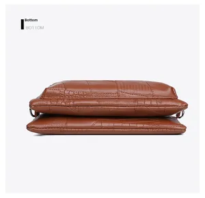 Detail view of the brown alligator embossed PU leather bag showing the multi-layered bottom