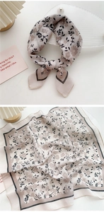 Detail of pink floral cotton-linen square scarf with black flower print and contrast border