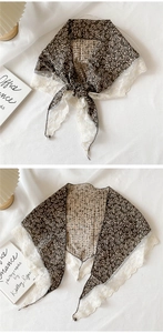 Detail of floral cotton triangle scarf with white lace trim and dark brown flower pattern