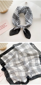 Detail of checkered cotton linen scarf showing the classic black and white pattern texture