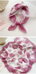 Detail of pink and white polka dot lightweight linen silk scarf with soft texture
