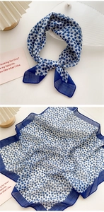 Detail of navy floral cotton linen square scarf with delicate flower patterns and border