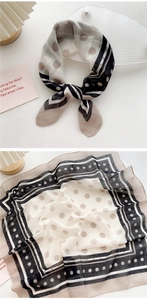 Detailed view of the sheer polka dot scarf with striped borders and elegant texture