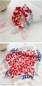 Detail of cotton linen square scarf with red floral checkerboard and Smile More print