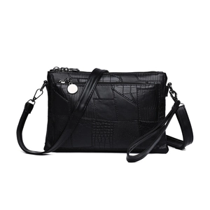 Women's black multi-textured patchwork PU leather crossbody bag with silver hardware