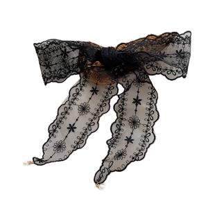 Elegant black lace bow hair ribbon with floral patterns and delicate pearl charms