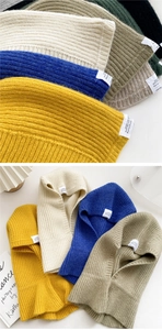 Detailed knit texture of rib-stitch balaclava scarves in various trendy autumn colors