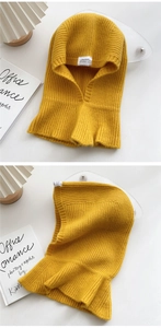Detailed close-up of yellow ribbed knit balaclava showing thick woven texture and hood