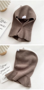 Close-up of vertical ribbed texture on brown knitted balaclava with warm wool finish