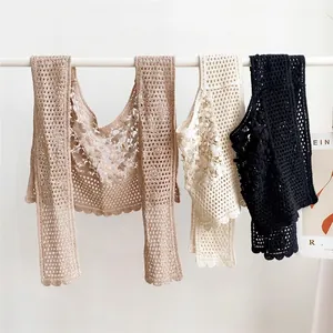 Crochet hollow lace knit shawls in khaki, beige and black shown on a hanger display