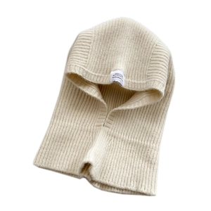 Creamy white ribbed knit balaclava hood with soft fuzzy texture and woven label