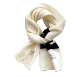 Minimalist cream and black striped long knitted scarf in a thick warm winter wrap style