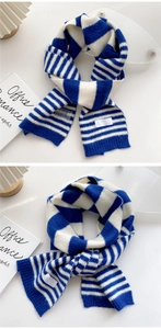 Detailed knit texture of navy and white striped winter scarf with premium edge finishing