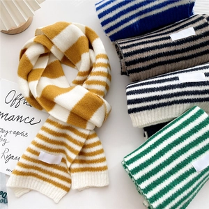 Soft striped knitted scarves in yellow, blue, and green for winter warmth and comfort