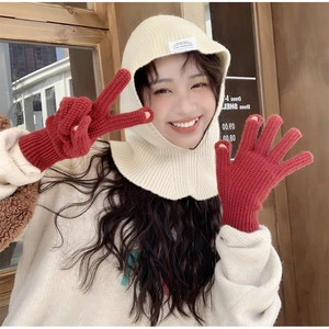 Close-up of knit hood with red gloves featuring touchscreen-friendly open fingertips