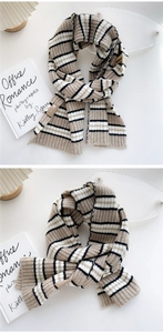 Detail shot of khaki and black striped knit scarf with leather brand label