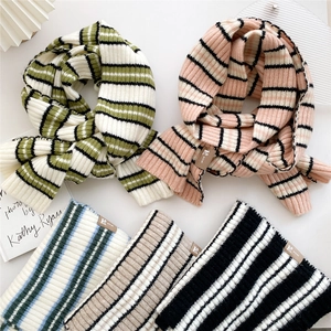 Striped knitted winter scarf for women in multiple colors with woven brand label