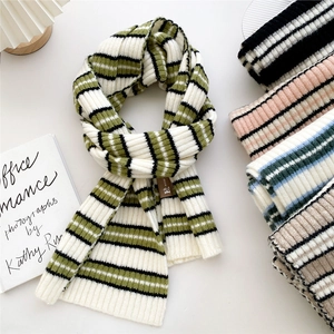 Winter striped knit scarf for women with soft texture and leather patch detail