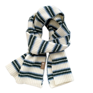 Cozy knit striped scarf in blue, white and green with a brown leather patch detail