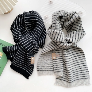 Thick striped knit winter scarf for women in black and grey with premium leather patch