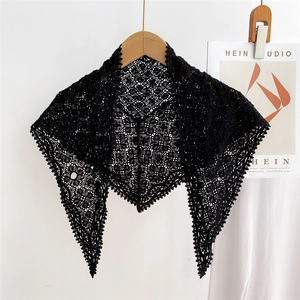 Chic black lace crochet triangle scarf shawl with hollow patterns on wooden hanger