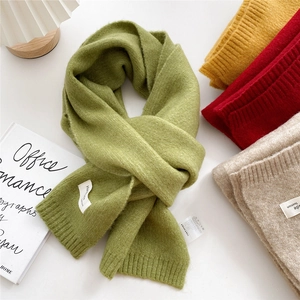 Knitted long scarf in grass green, yellow, and red with handmade fashion label
