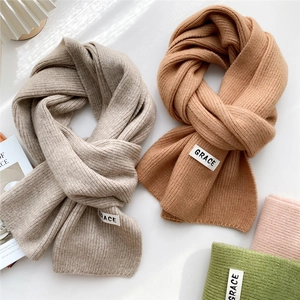 Thick knit solid scarf with GRACE letter label and vertical stripe texture for winter