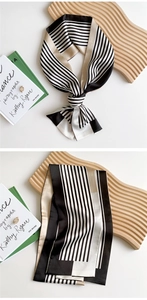 Close-up of narrow striped silk twilly scarf showing elegant French style and texture